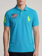 ninesixfits blue cotton Ralph Lauren Big Pony USA polo shirt with neon green accents and USA flag detail.